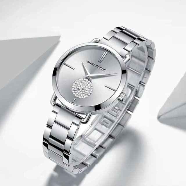 Side view highlighting the slim case and crystal crown