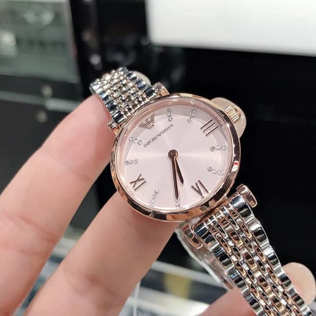Soft pink dial with Roman numerals and Emporio Armani logo